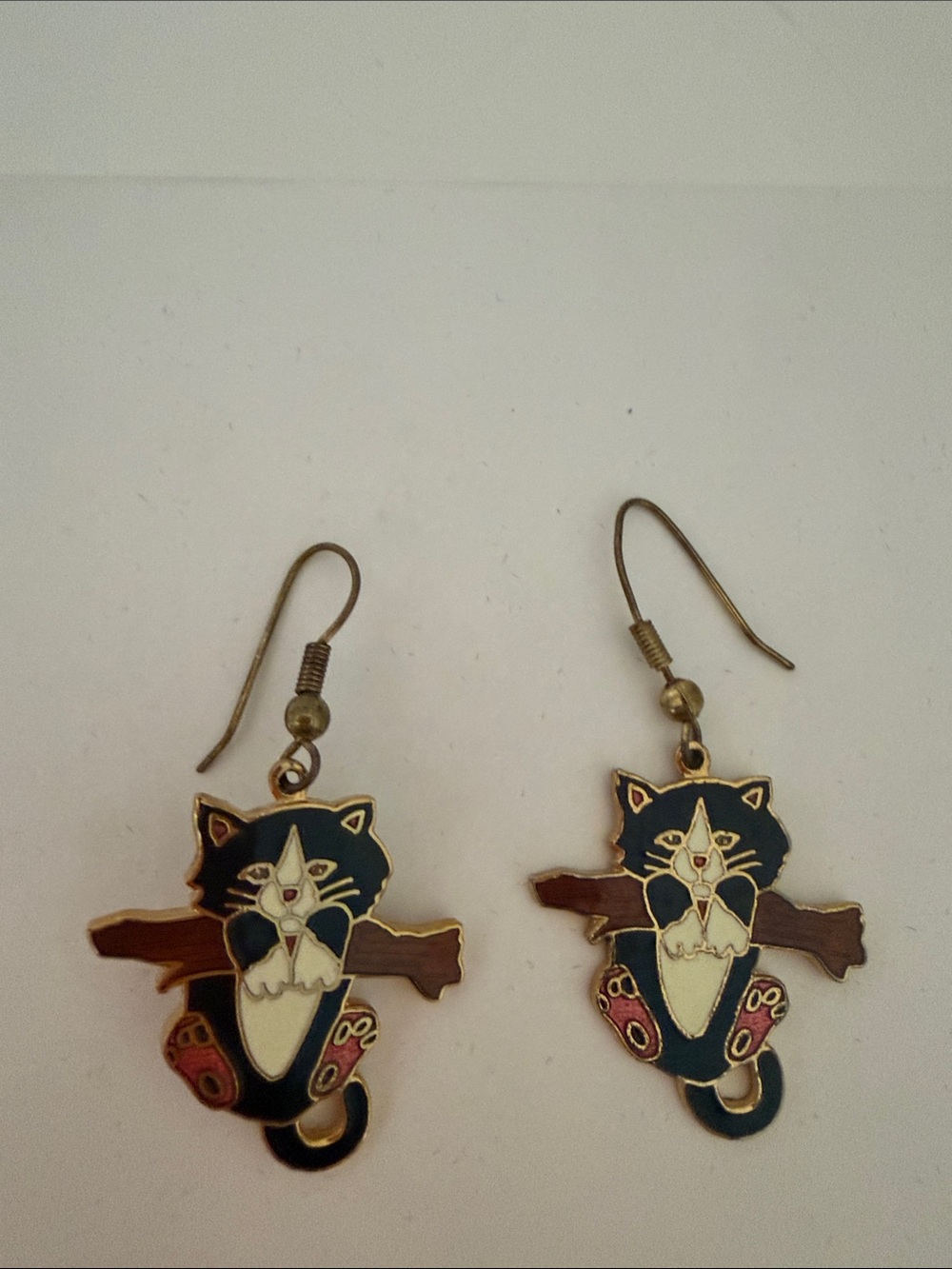 “Kitty hanging from a Branch black&white Cat Enamel Dangle Earrings,gold accents